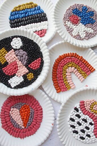 dried-bean-mosaics Six paper plates with bean mosaic designs glued to each one