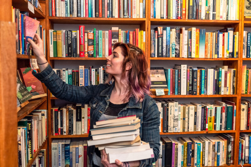 Working in an independent bookstore A woman putting books on the shelves of an independent bookstore in San Francisco's Mission District.