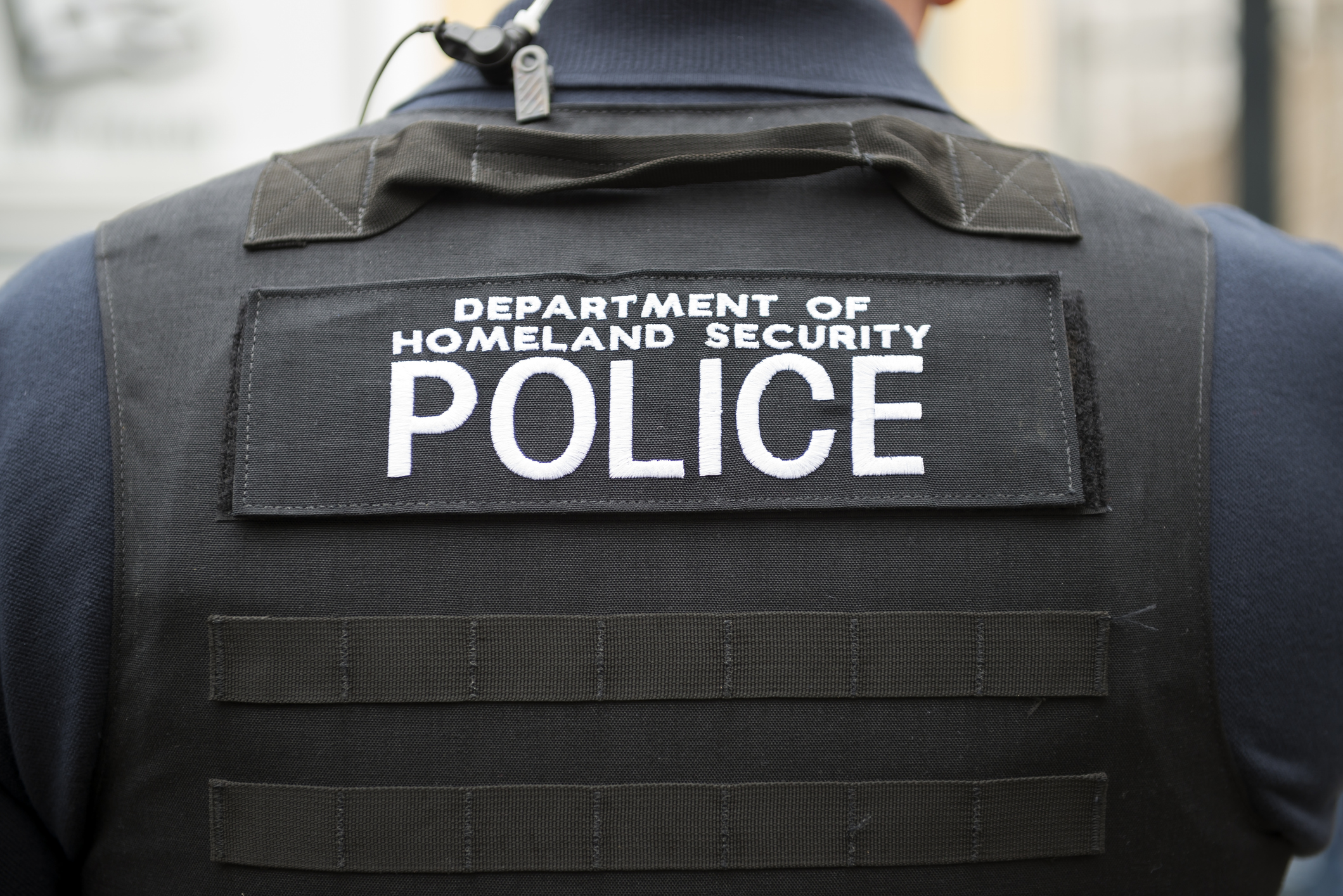 Photo of police officer during mass deportations in schools