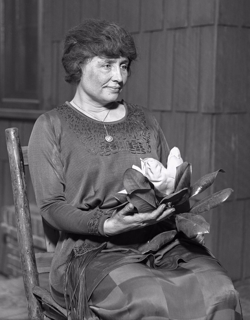 Helen Keller Helen Keller sitting in chair.