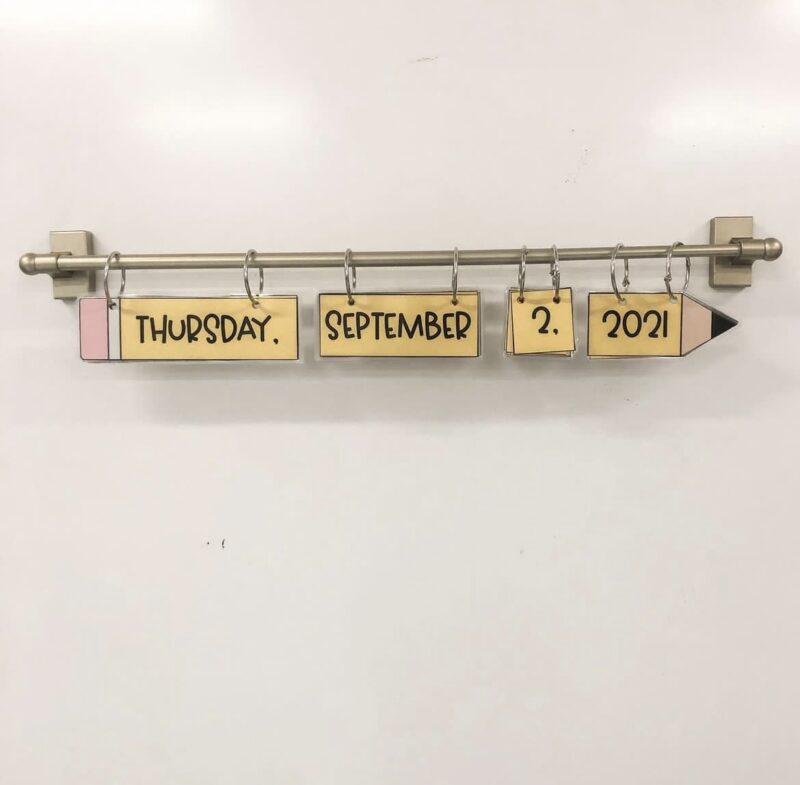 curtain-rod shower rod with the date hung up for a teacher hack