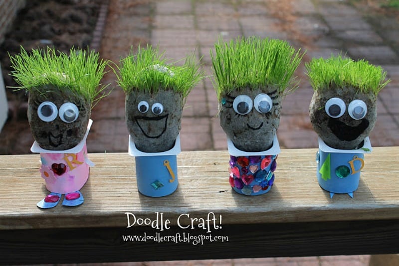 Recycling_YogurtContainers creatures made from yogurt containers with clumps of dirt sticking out of the top, with grass hair, googly eyes and smiles drawn with a marker