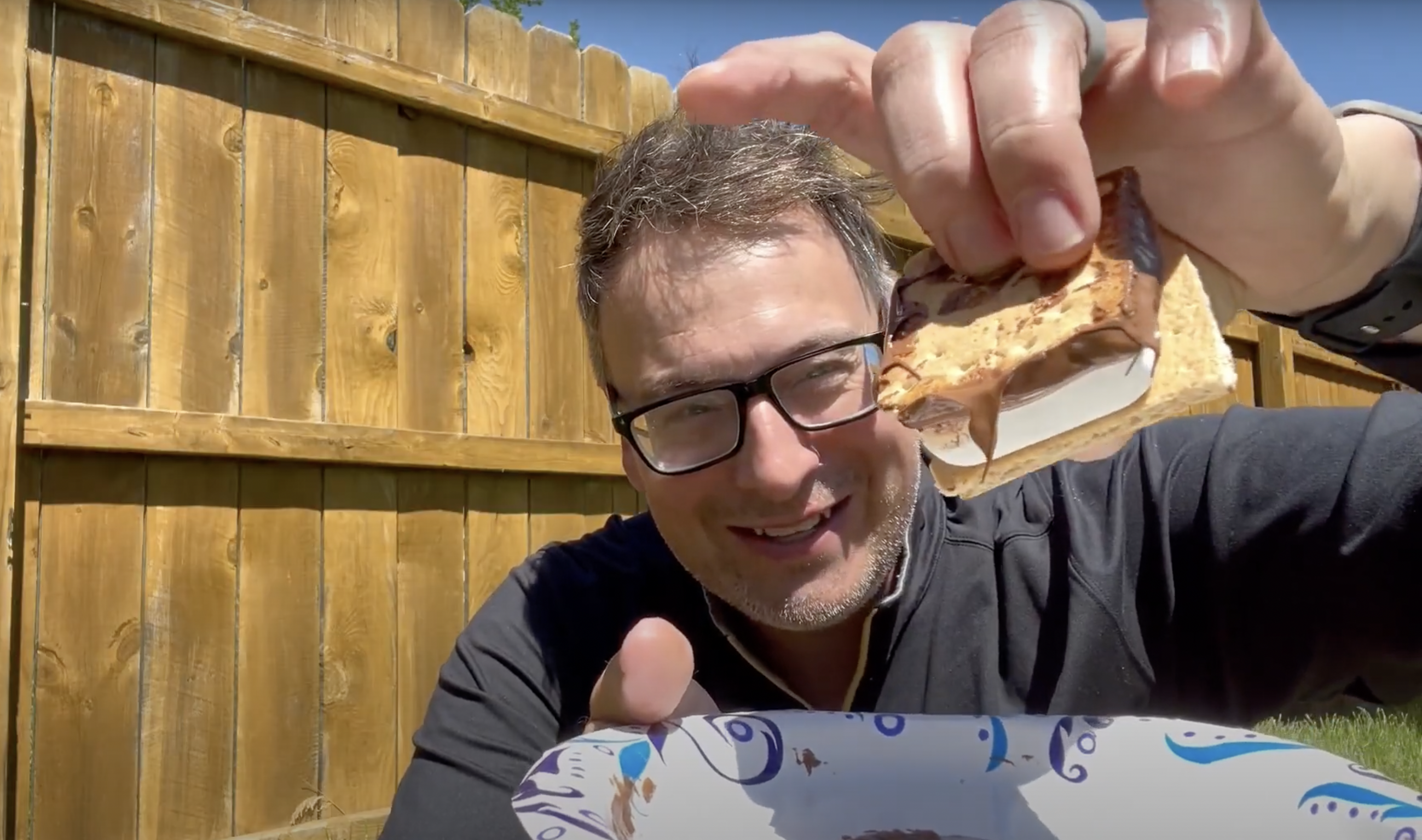 smore Man holding up s'more- solar oven science project