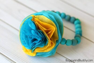 tissue-paper-flower-bracelet A blue and yellow bracelet made from tissue paper and wooden beads