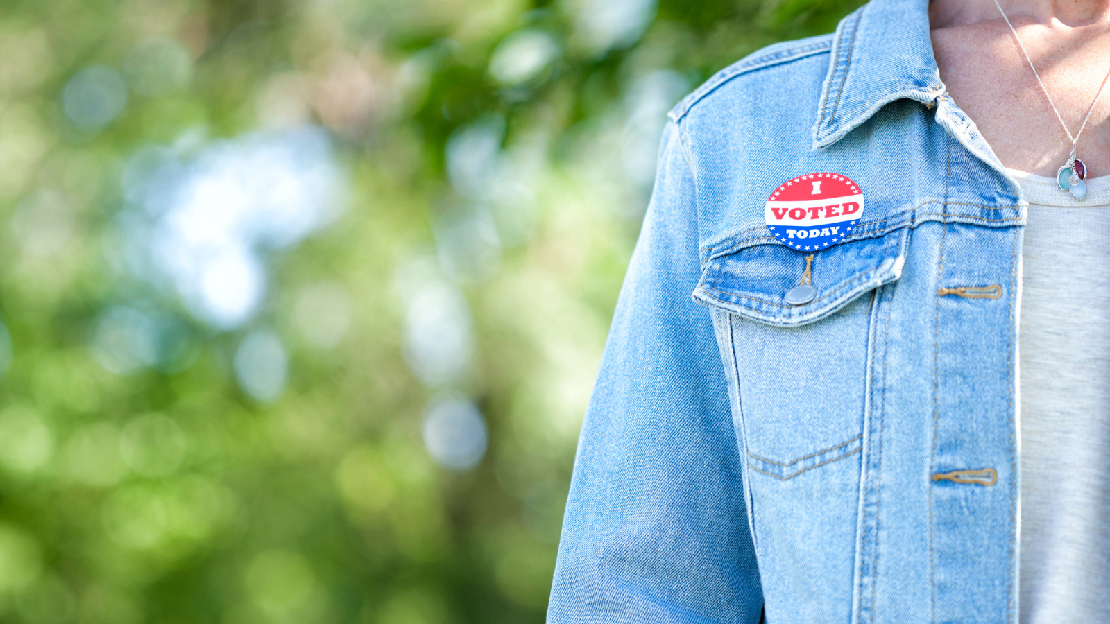 Teacher with I Voted sticker to show teacher voices matter