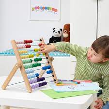 Abacus A little girl plays with an abacus.