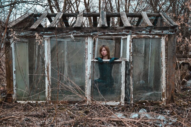 Writing Prompts: Abandoned Greenhouse Woman inside an abandoned ramshackle greenhouse in the woods