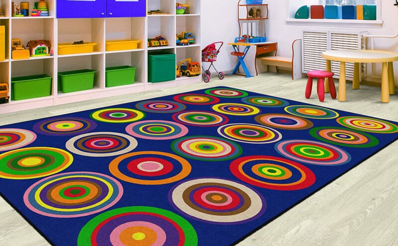 Seating Circles Rug A blue rug with colorful circles on it as an example of classroom rugs.