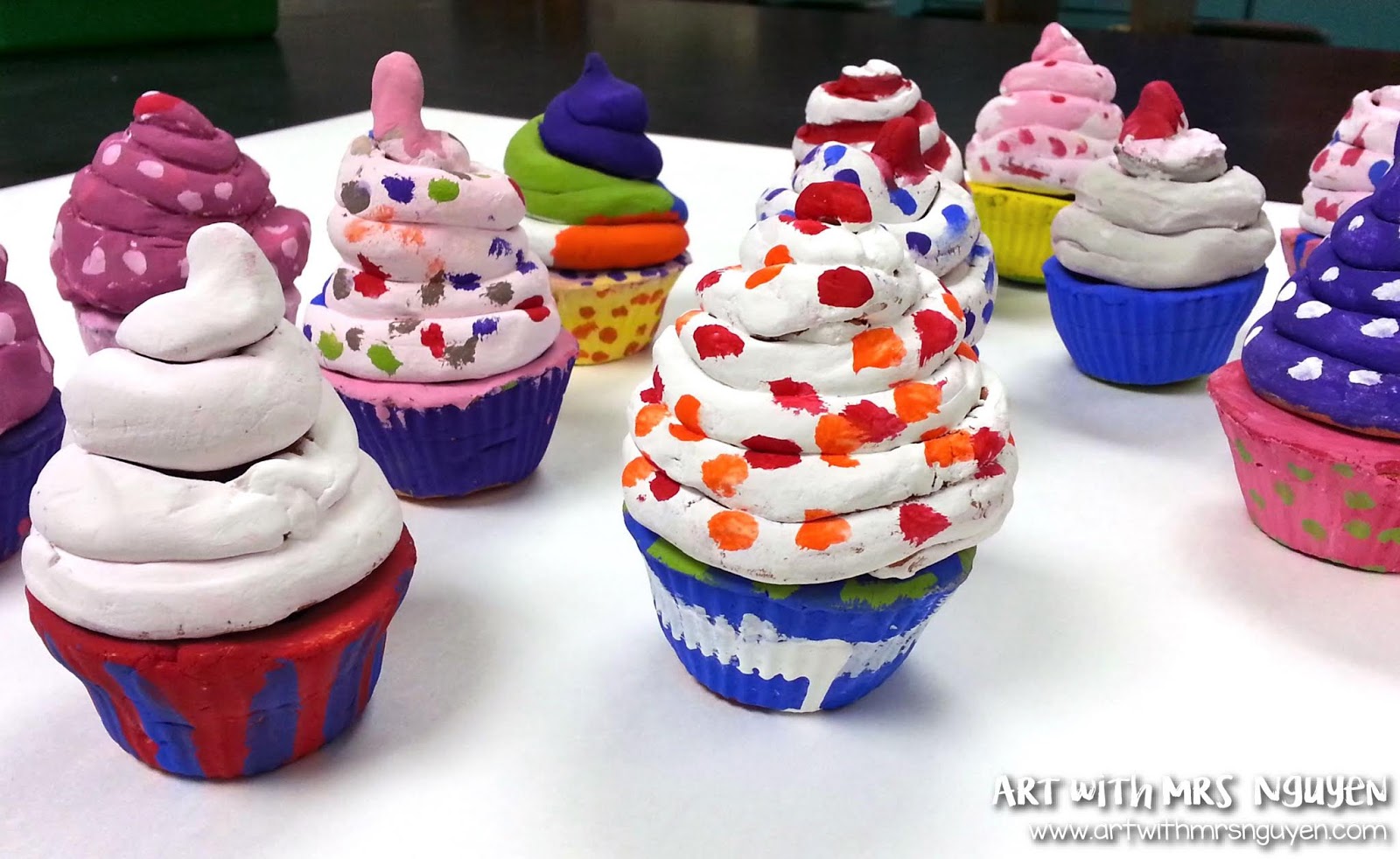Clay Cupcakes Clay cupcake pots with removable frosting lids, made as a fourth grade art project