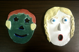 Clay Masks Two clay masks of human faces created as a fourth grade art project