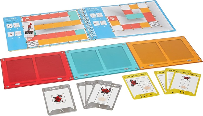 Book, board, and cards for the game On the Brink