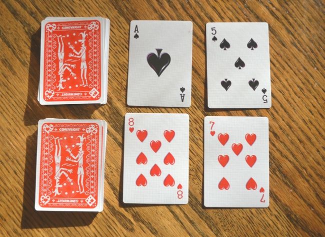 Dollar Store Hacks: Cards War Two decks of playing cards with four cards face up next to them as an example of dollar store hacks for the classroom