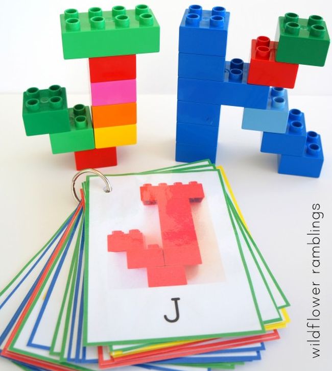 Dollar Store Hacks: Lego Letters The letters J and K built from LEGO bricks, with a stack of cards