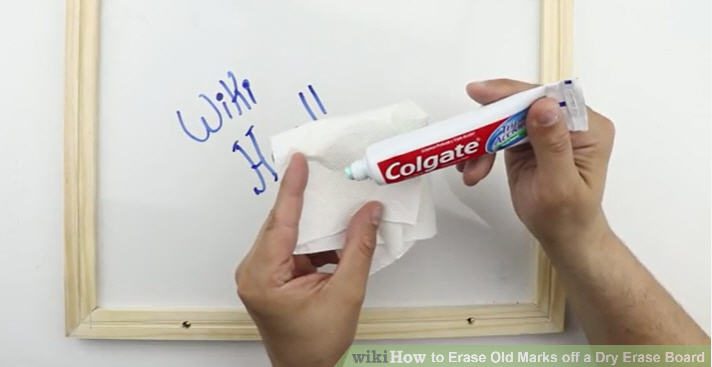 Dollar Store Hacks: Toothpaste Teacher using toothpaste on a rag to clean a white board