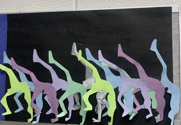 Paper Movement Art A child's full silhouette in a creative pose is shown in multiple overlapping colors on a black background