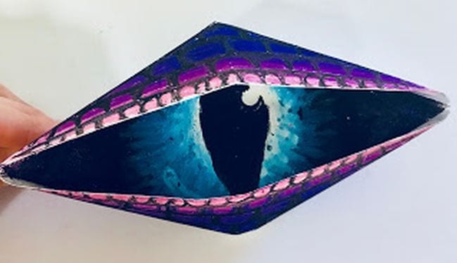 Fifth Grade Art Origami Dragon Eyes Purple paper eye folded out of paper and colored