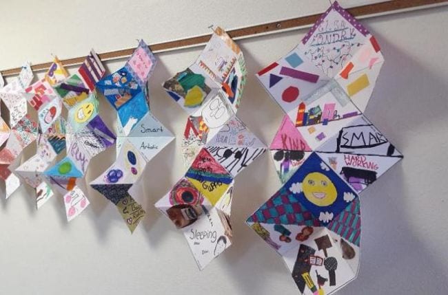 Fifth Grade Art Squash Books Folded paper squash books hung along the wall (Fifth Grade Art)