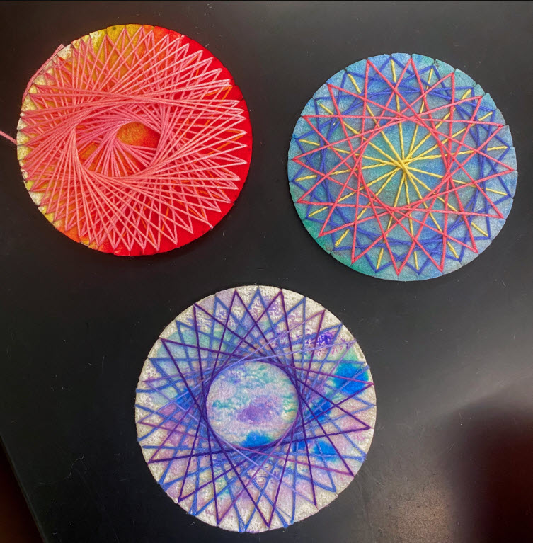 Geometric String Art Three circular geometric string art creations made by fourth graders