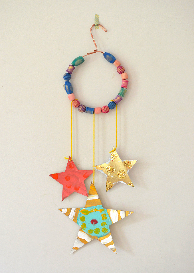 glitter_star_mobile Glittery hand made stars dangle from a beaded copper wire
