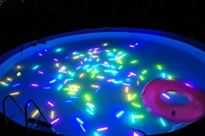 glow-sticks-kiddie-pool glow sticks in a kiddie pool for a water activity