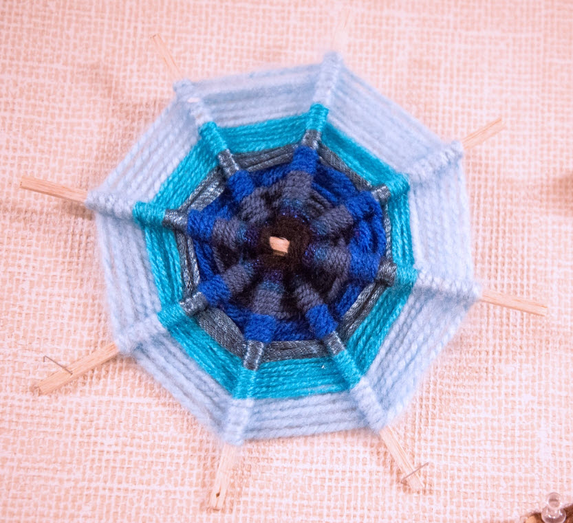 Fifth Grade God’s Eyes A traditional god's eye craft made with four sticks instead of two and shades of blue yarn