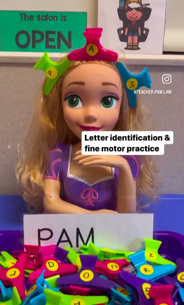 hair-clips A large doll with colorful hair clips labelled with letters in her hair as an example of dollar store hacks for the classroom