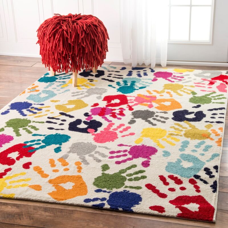 Hand Print Rug Rug with the design of colorful handprints on it.