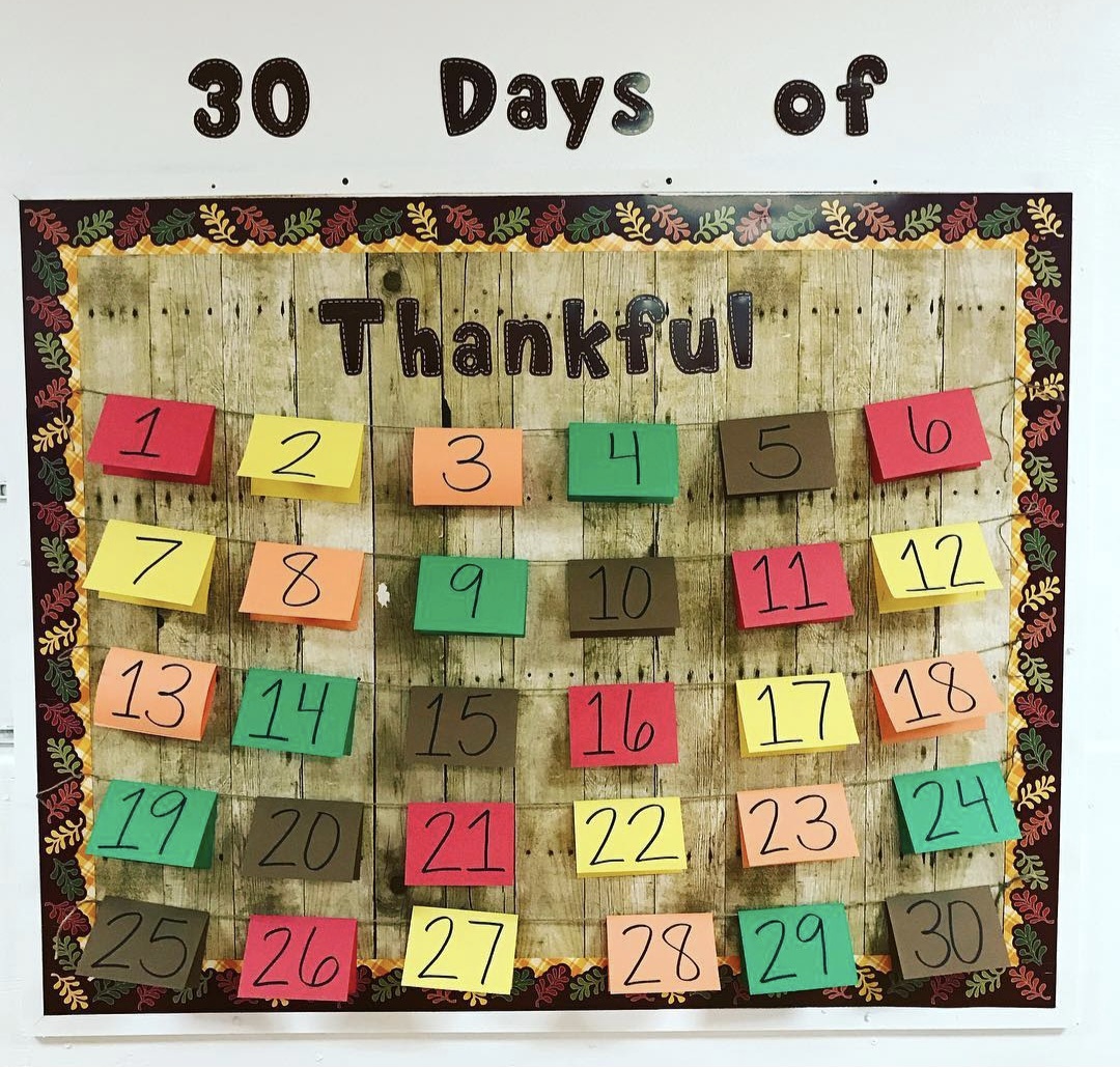 Interactive Bulletin Boards: Gratitude 30 Days of Gratitude bulletin board with a card holding a different reason to be thankful for each day of November