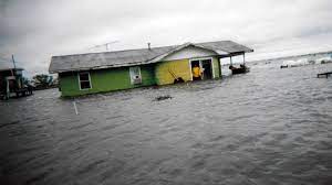 isle-de-jean-charles house in flood water for a project on the five themes of geography