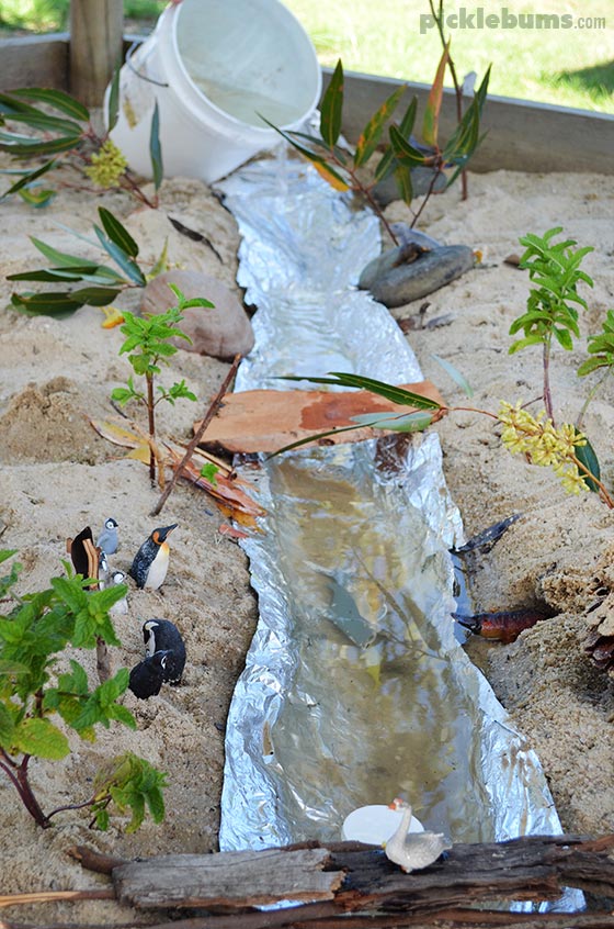 make-a-river a river made with foil on a dirt path and water