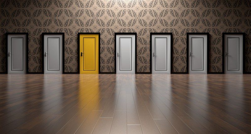 Picture Writing Prompts: Doors A row of white doors with one yellow door (Picture Writing Prompts)