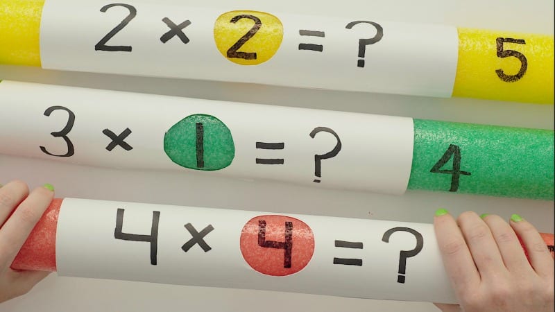 pool-noodle-multiplication pool noodles with multiplication facts on them
