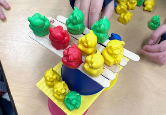 lava-toys Toy bears stacked on plastic cups, wood craft sticks, and index cards