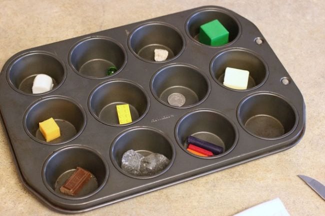 muffin-tin Muffin tin with different objects in each well as an example of science activities for preschoolers