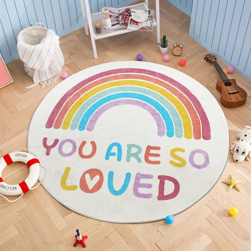 Rainbow Message Rug A round rug features a rainbow and the message You are So Loved.