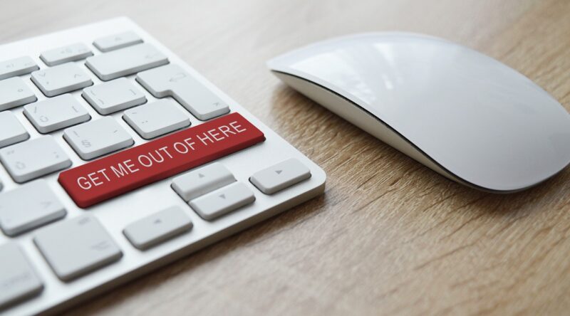 Picture Prompt: Rescue Button Computer keyboard with a red button reading Get Me Out of Here
