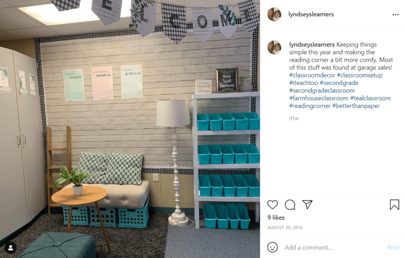 Simple reading corner in a classroom with shelving and milk crates turned upside down to make a seat
