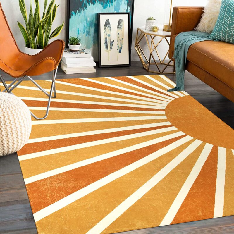 Sun Rug A rug shows the rays of the sun in different bright shades of orange.