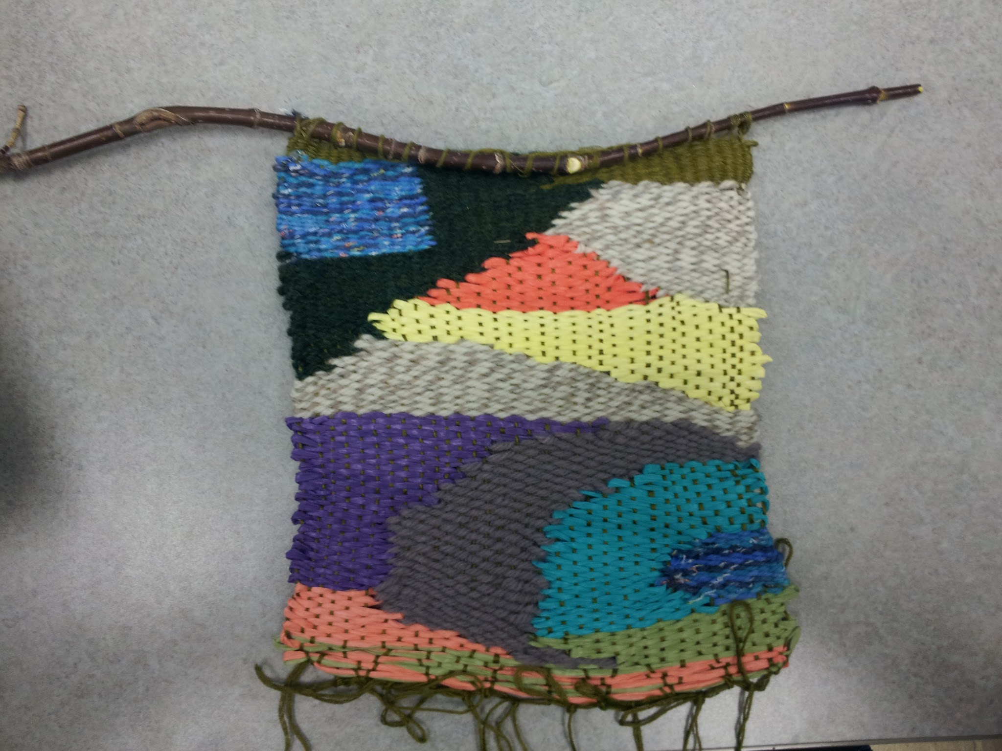 Tapestry Weaving A yarn tapestry with an abstract design woven on sticks