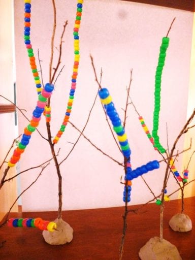 Beaded Tree Art 3-D trees have beads strung on them in this example of kindergarten art projects.