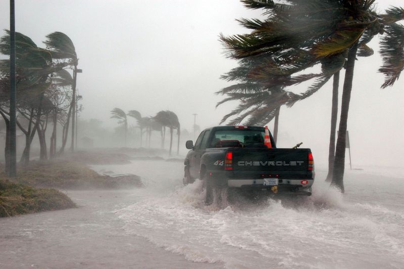 Writing Prompts: Truck in a STorm Pickup truck driving through flooded streets in a storm