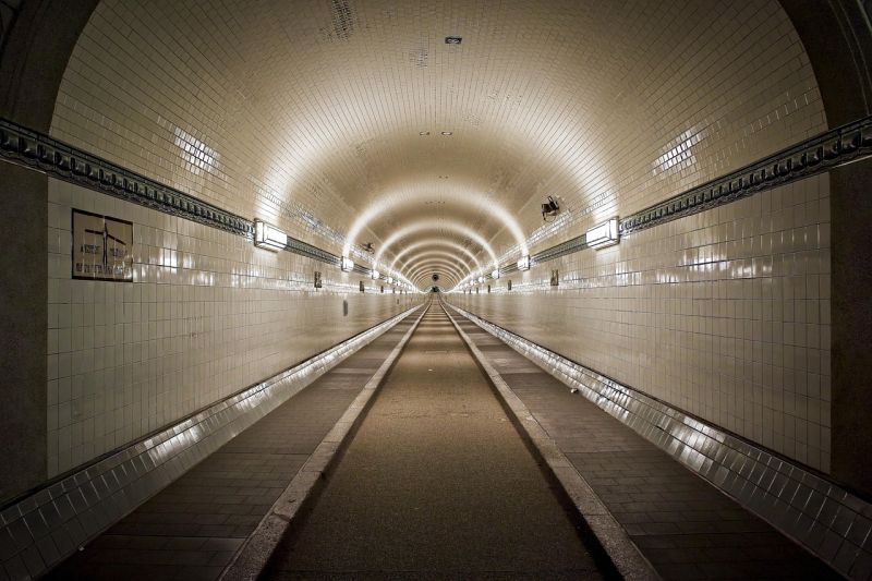 Picture Prompt: Tunnel A white-tiled tunnel stretching far into the distance