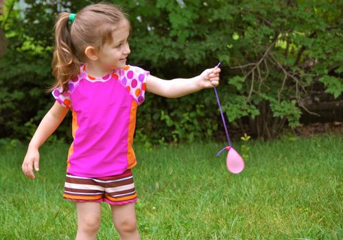 Water-Balloon-Yo-Yo child holding a water balloon