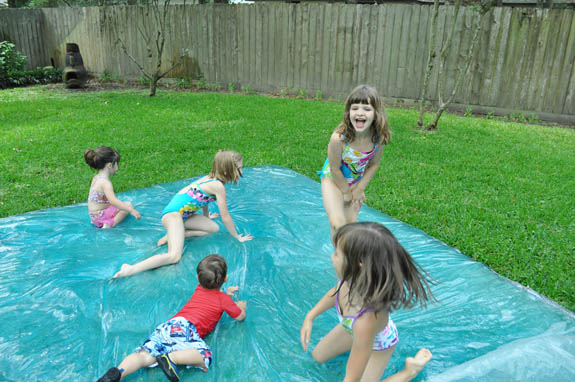 water-blob kids sitting on a water blob or big bag filled with water