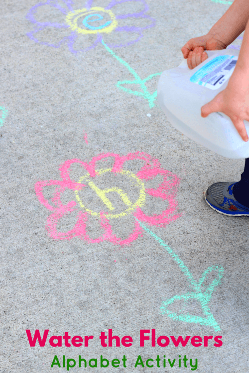 Water the Flowers person pouring water on flowers drawn in chalk on sidewalk