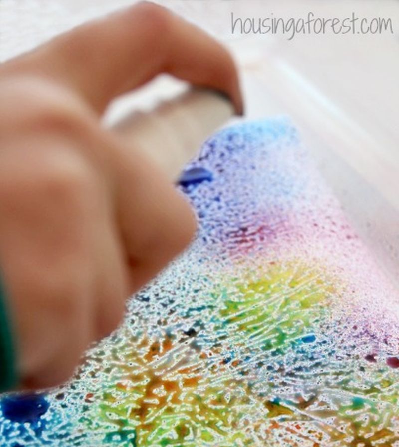 wax-paper Child spraying colored water onto wax paper