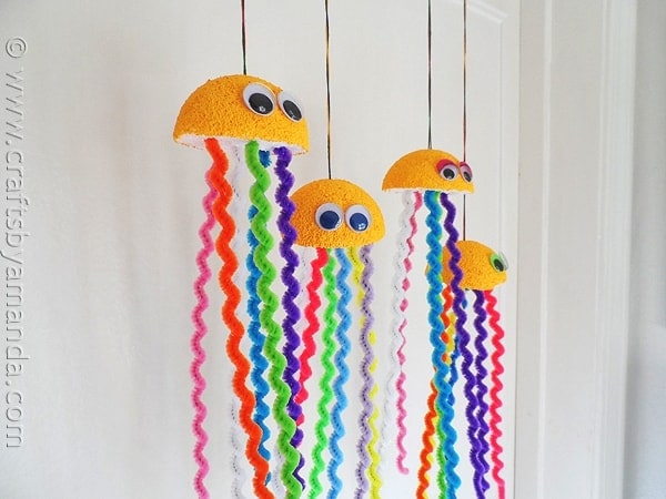 wiggly-jellyfish Whimsical jellyfish made from styrofoam, pipe cleaners and googly eyes hang from the ceiling