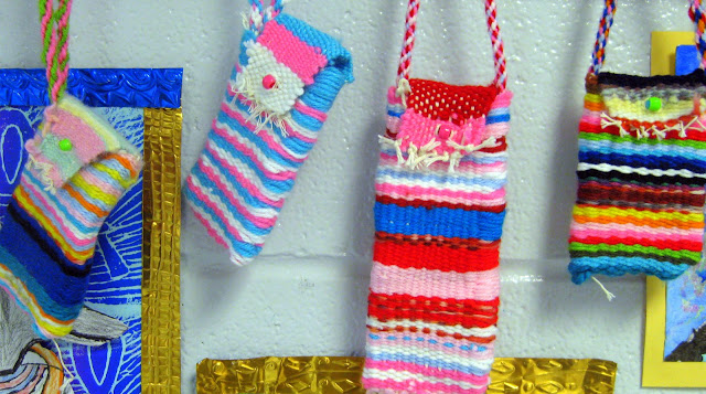 Woven Yarn Pouches Three colorful oblong pouches woven from yarn by fourth grade art students