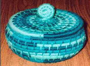 Yarn Coil Basket A basket in shades of blue made using the yarn coil method